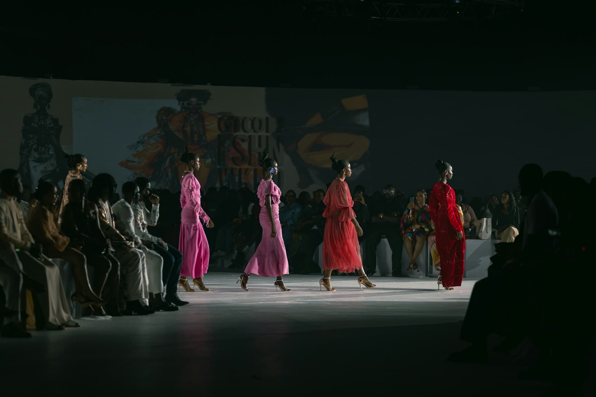 Models walk the runway during a live fashion show